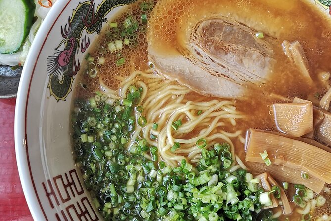 Home style Ramen and Homemade Gyoza in Kyoto - Cucumber pickles and the meal at the table