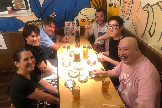 Hungry Osaka Street Food Tour:15 Tastings & 3 Drinks with a Local - Walking through Tsutenkaku and old Osaka