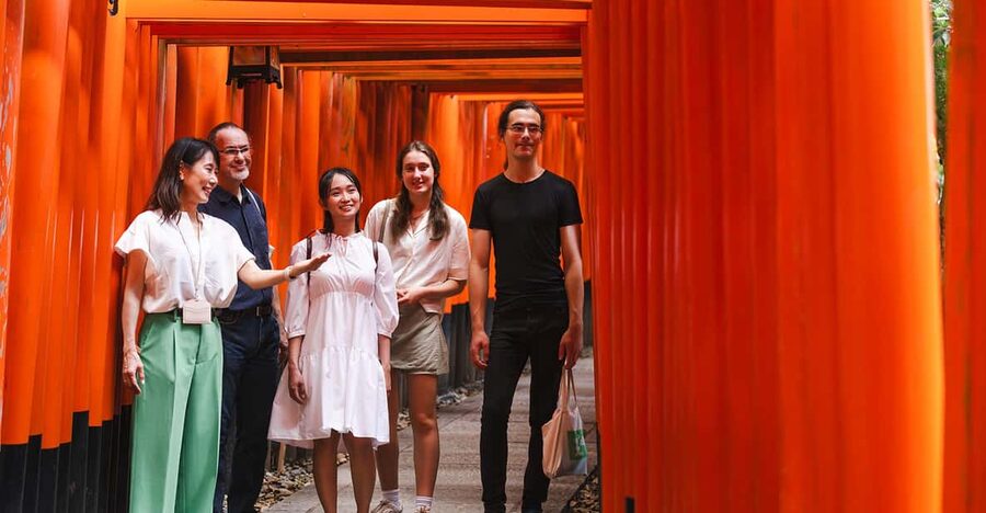 Kyoto: Fushimi Inari Taisha Shrine Walking Tour with Guide - Riding the train to Fushimi Inari