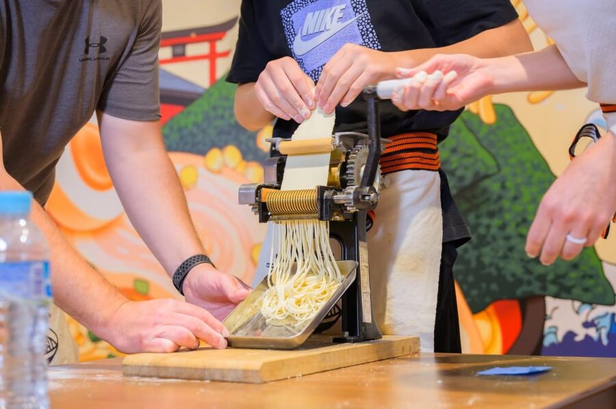 Kyoto: Ramen Cooking Class at a Ramen Factory with Souvenir - Seasoning the chicken for a fast, satisfying meal