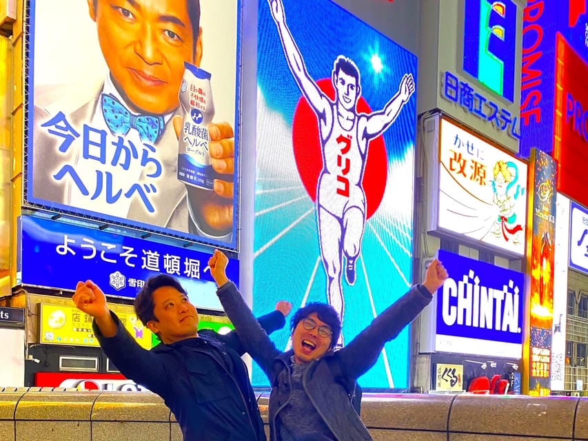 Osaka: 2-Hour Local Street Food Tour – Dotonbori & Namba - The Glico Man sign and Dotonbori’s neon corridor