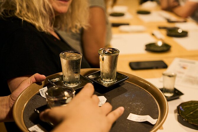 Osaka: Guided Food Tour with 12 Dishes at 4 Local Eateries - Starting with dumplings and takoyaki