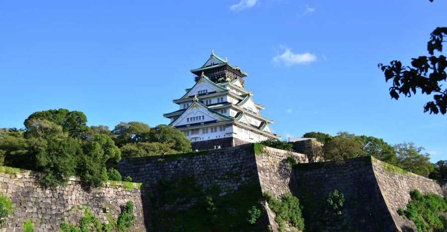 Osaka: Main Sights and Hidden Spots Guided Walking Tour - Osaka Castle Park and the story behind the stone walls