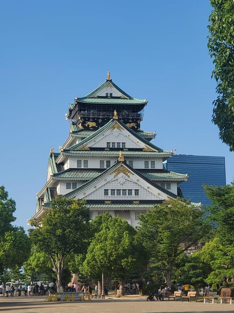 Osaka: Walking Tour and Top Highlights - Osaka Castle gives you the grand opening