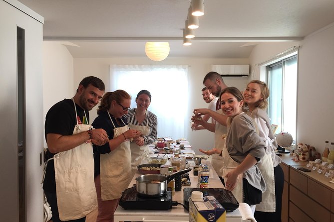 Ramen & Gyoza Cooking Class in Tokyo with Local Supermarket Visit - Folding gyoza while the ramen cooks