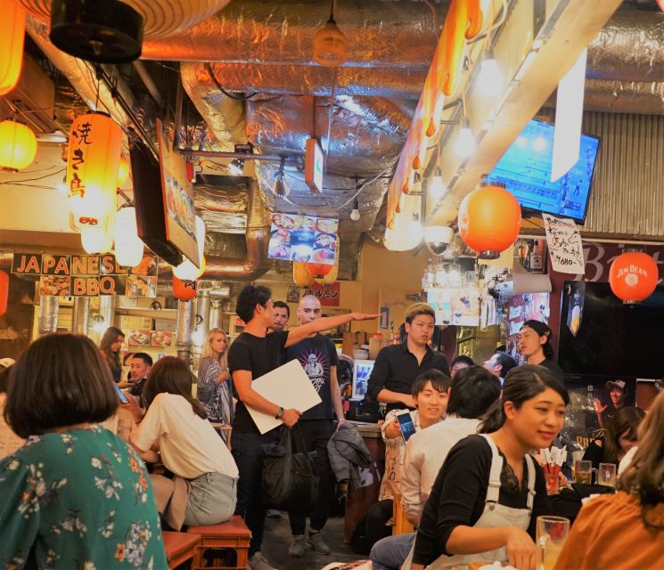 Shibuya Meltdown Night Tour: All-You-Can-Drink Bar Hopping - Starting under the SHIBUYA TSUTAYA sign
