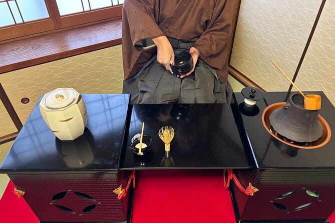Tea Ceremony in 150 Years Old Townhouse with Tables and Chairs - What the tea master explains first