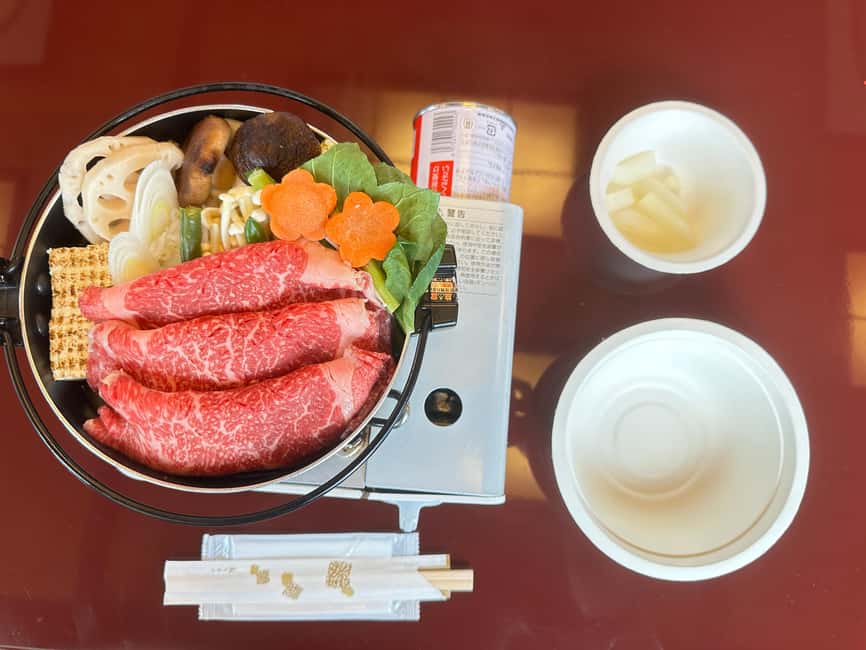 Tokyo Dinner Cruise & Tradition Show & Drinks & Tokyo Tower - Sukiyaki, soft drinks, and the meal setup